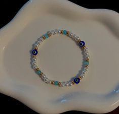 Evil Eye glass bead bracelet pearl beads with blue beads Evil Eye Beaded Bracelet, Glass Bead Bracelet, Bracelet Pearl, Eye Glass, Glass Beaded Bracelets, Blue Beads, Bead Bracelet, Glass Bead, Pearl Bracelet