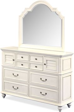 a white dresser with a mirror on top of it