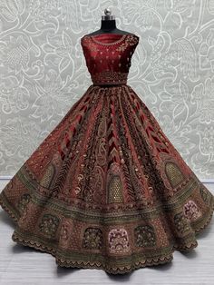 This stunning maroon color velvet bridal lehenga, exquisitely crafted to make you shine on your special day. The richness of the velvet material combined with intricate details such as multi-thread work, sequin work, diamond work, zari work, embroidered work, hand mirror work, and fancy dori work, ensures a masterpiece that epitomizes luxury and grace. The attention to detail in every stitch and embellishment speaks volumes about the craftsmanship that went into creating this ensemble.
Paired wi Reception Traditional Velvet Wear With Intricate Embroidery, Velvet Traditional Wear With Intricate Embroidery For Reception, Heavy Red Dupatta With Traditional Drape, Traditional Heavy Red Dupatta, Wedding Velvet Fitted Lehenga, Semi-stitched Velvet Lehenga For Reception, Traditional Velvet Lehenga For Reception, Velvet Lehenga For Reception With Traditional Drape, Red Heavy Lehenga For Festive Occasions