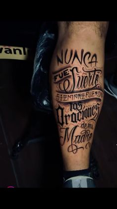 a man's leg with some writing on it and the words nugg are in black