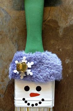 a toothbrush holder with a snowman's hat on it