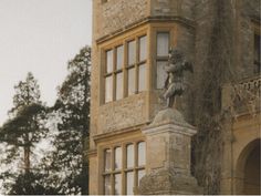 an old building with a statue on the front