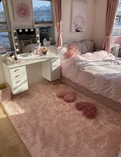 a bedroom with pink carpet and white furniture