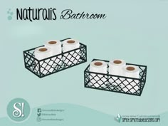 two black baskets with rolls of toilet paper in them and the words natruss bathroom above it