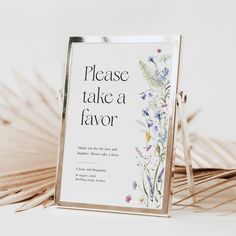 there is a sign that says please take a flavor with flowers on the front and side