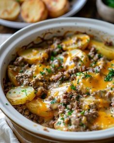 a casserole dish with potatoes and ground beef