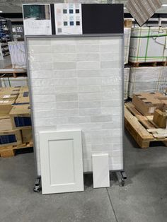 a large white brick wall in a warehouse