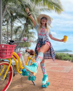 a woman riding on the back of a yellow bike