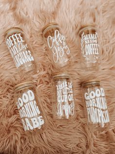 four glass jars with the words coffee, good morning and good night written on them