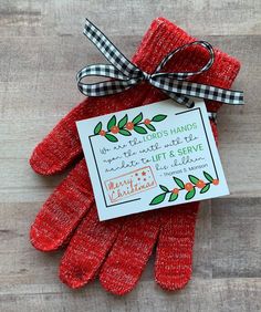 red mittens tied up with a card and ribbon