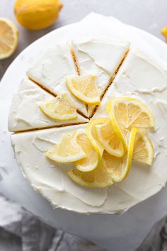 a white cake with lemons on it