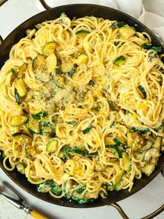 pasta with zucchini and spinach in a skillet