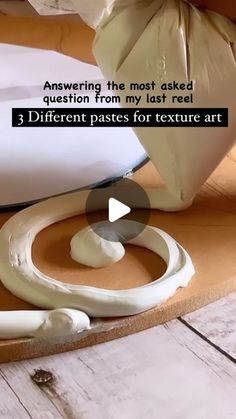 a video demonstrating how to make an art project with white paint on wood planks