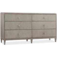 an image of a dresser with drawers and knobs on the bottom, in grey linen