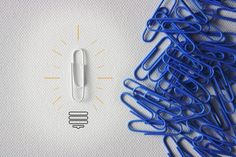 blue binders and paper clips on white background with lightbulb - stock photo