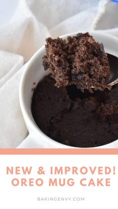 a close up of a spoon in a bowl with cake on it and text overlay reading new & approved oreo mug cake