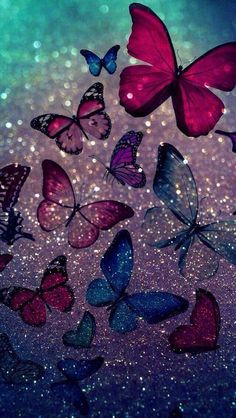 many butterflies flying in the air with glitter on it's back and blue sky behind them