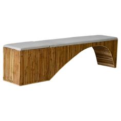 a bench made out of wood and concrete with a white top on the back side