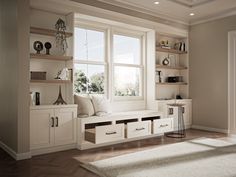 a living room filled with furniture and lots of windows