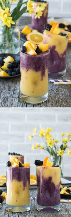 two shots of blueberry cheesecake in small glass cups with flowers on the side