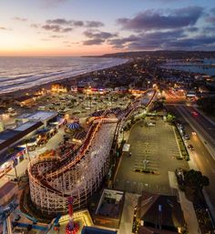 an aerial view of a carnival at dusk