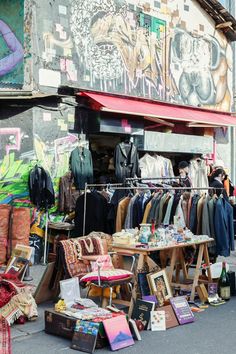 an outdoor clothing store with clothes on display