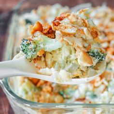 a spoon full of broccoli and cheese casserole