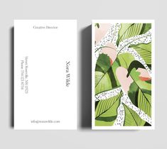 a business card with green leaves and pink flowers on the front, and white background