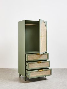 a green cabinet with three drawers and wicker handles