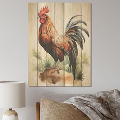 a rooster is standing on a piece of wood