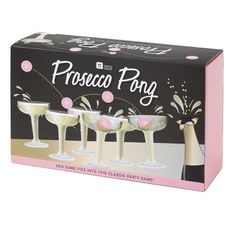 three champagne flutes in a box with pink and white confetti on the top