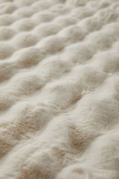 the texture of an unmade bed is shown in this close up photo, with no sheets