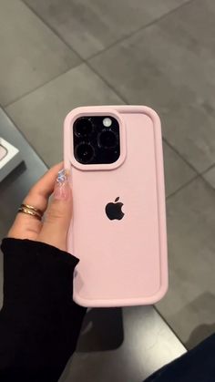 a person holding up an iphone case in their hand, with the back cover open