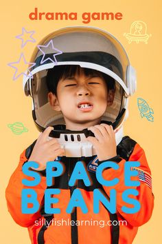 a young boy wearing an astronaut's helmet with the words space beans on it