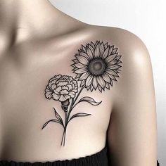 a woman with a sunflower tattoo on her chest and shoulder, it is black and white