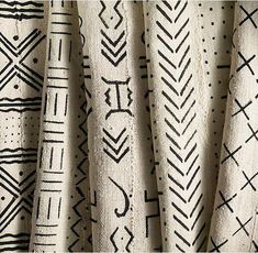 black and white fabric with designs on it