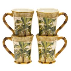 four coffee cups decorated with palm trees and wicker rimmed in gold, set on a white background