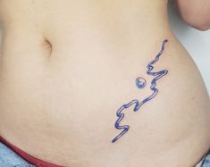 a woman's stomach with the word love written in cursive writing on it