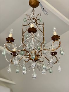 a chandelier hanging from the ceiling in a room