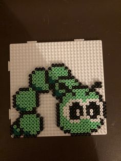 the legos are made to look like they have green and black designs on them