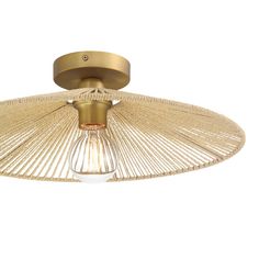 the ceiling light is made out of wicker and has a gold metal fixture on it