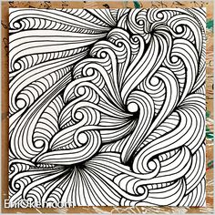 an abstract drawing with black and white swirls on brown paper, in the shape of a