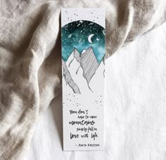 a bookmark with an image of mountains on it