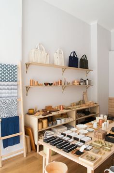 a room filled with lots of different items on top of wooden shelves next to each other