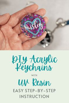 a hand holding a keychain with the words, diy acrylic peych