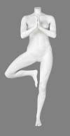 a white female mannequin standing on one leg with her arms stretched out to the side