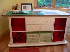 a desk with drawers and a laptop on it in a child's playroom