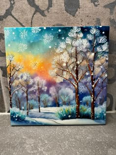 an acrylic painting of trees and snow on a wall with the sun setting in the background