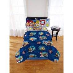 a bed with paw patrol comforter and pillow cases