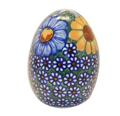 an egg with blue and yellow flowers painted on it